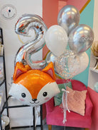  Fox balloon and two silver number two balloons.