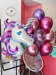 Celebrate in style with a unicorn balloon donning a purple and silver head.