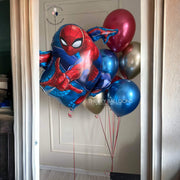 Spiderman balloon bouquet featuring red and blue balloons with Spiderman design, perfect for a superhero-themed party.