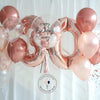 Beautiful rose gold birthday balloon bouquet with shimmering metallic finish, perfect for a special celebration