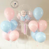 A vibrant bouquet of blue and pink balloons, creating a colorful and festive atmosphere.