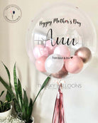 Happy Mother's Day balloon with a heart-shaped design, floating in the air, bringing joy and love.